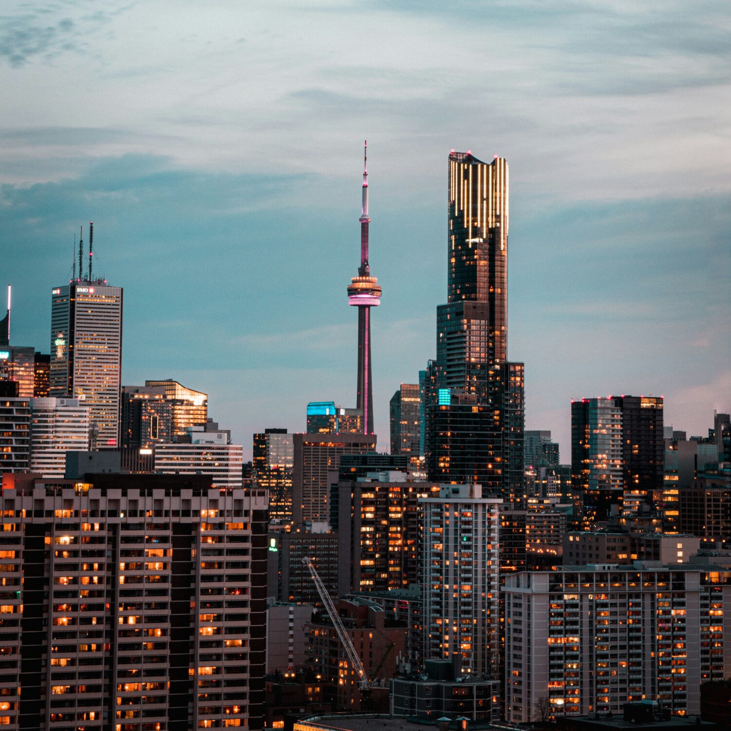 Toronto's skyline at sunset, with the CN tower in the middle.