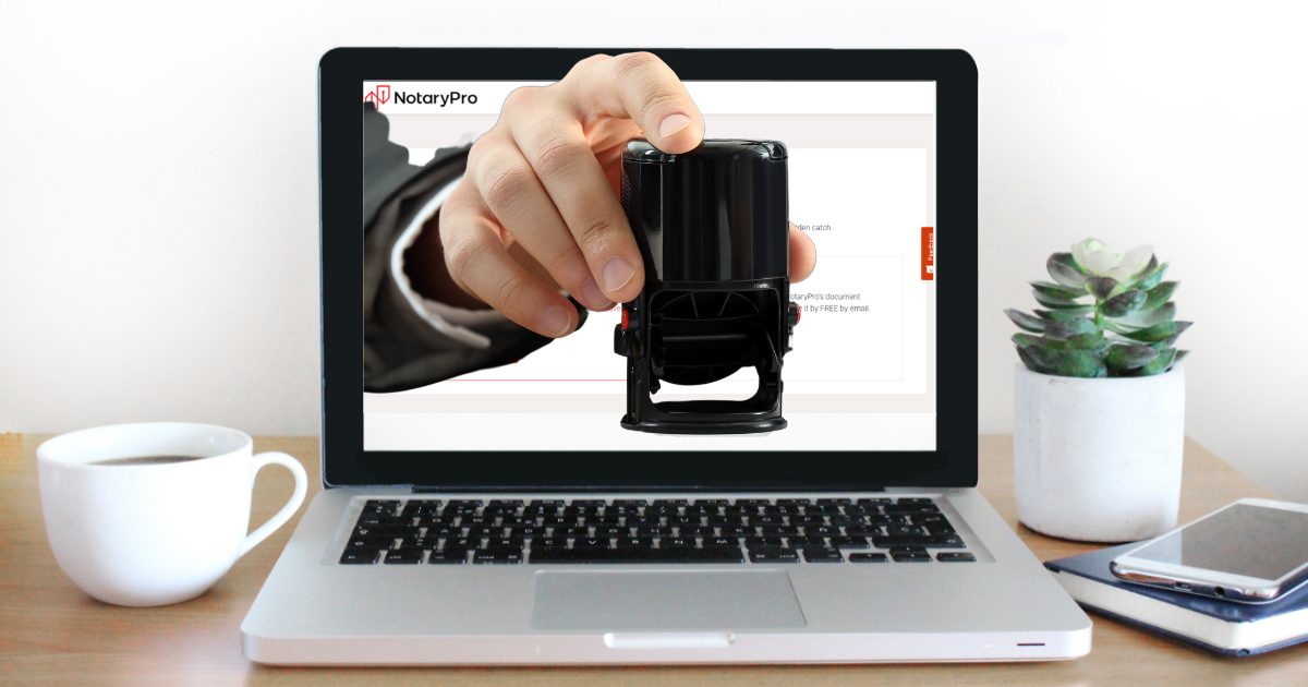 Hand with notary stamp reaching out of a laptop screen